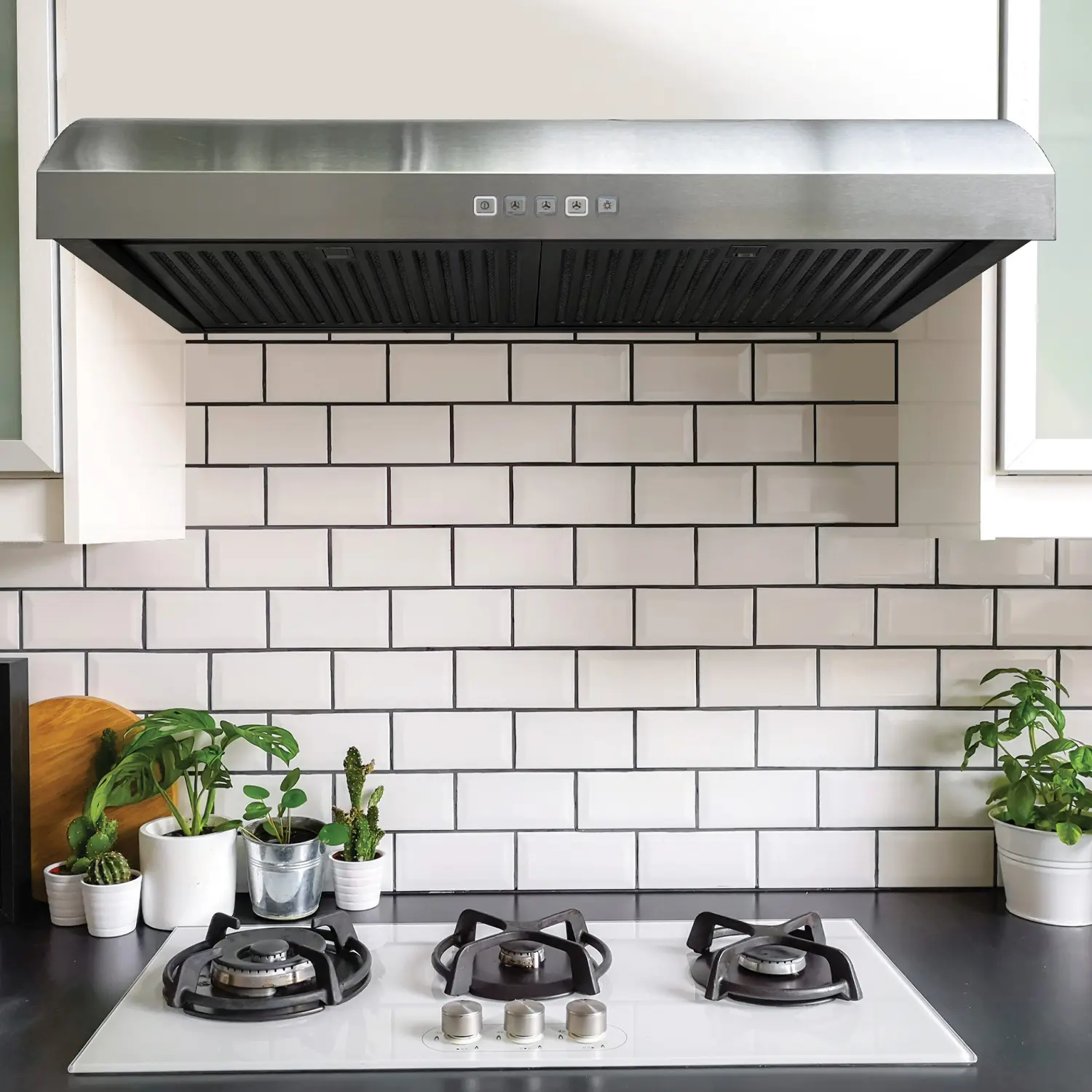 Stainless under-cabinet hood in a white kitchen