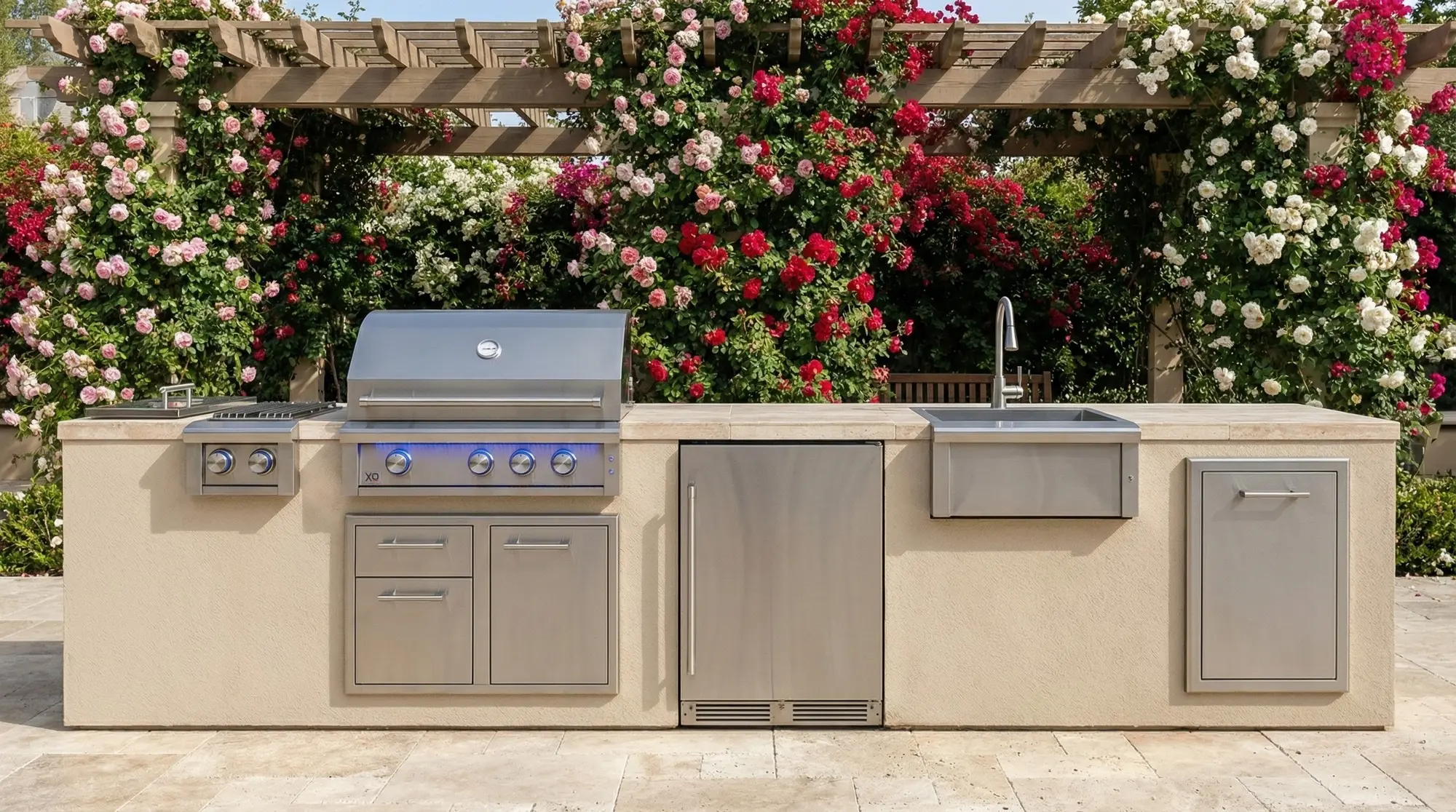 XO built-in grill, refrigeration, sink and storage beneath a flowering pergola