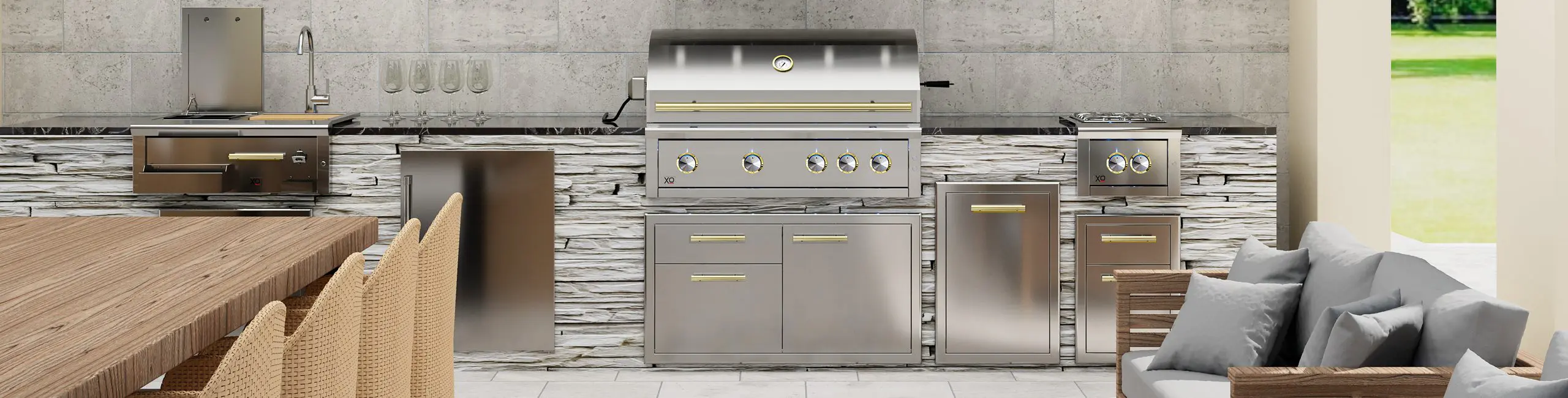 XO outdoor kitchen with gold accents on the grill and cabinet handles